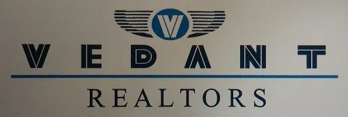 Vedant Realtors logo